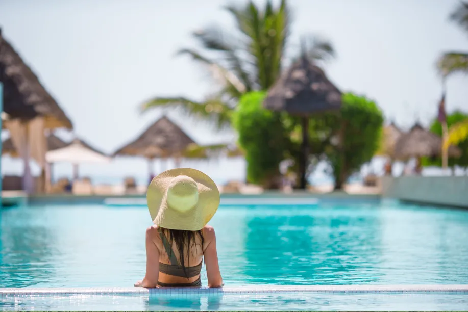 woman in a swimming pool enjoying the view in one of the luxury hotels in sri lanka