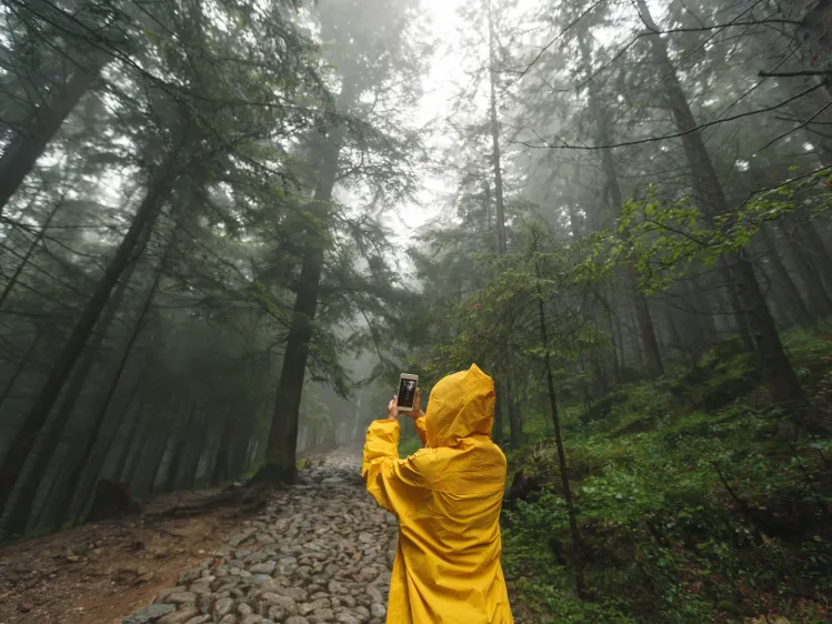 traveler wearing a rain coat