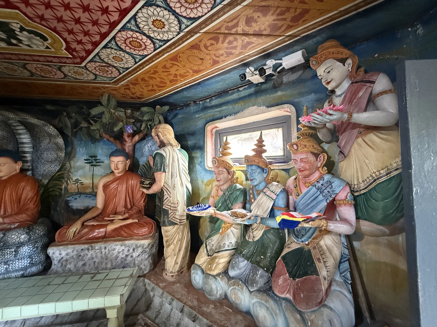 Buddha life scene statues in a shrine room