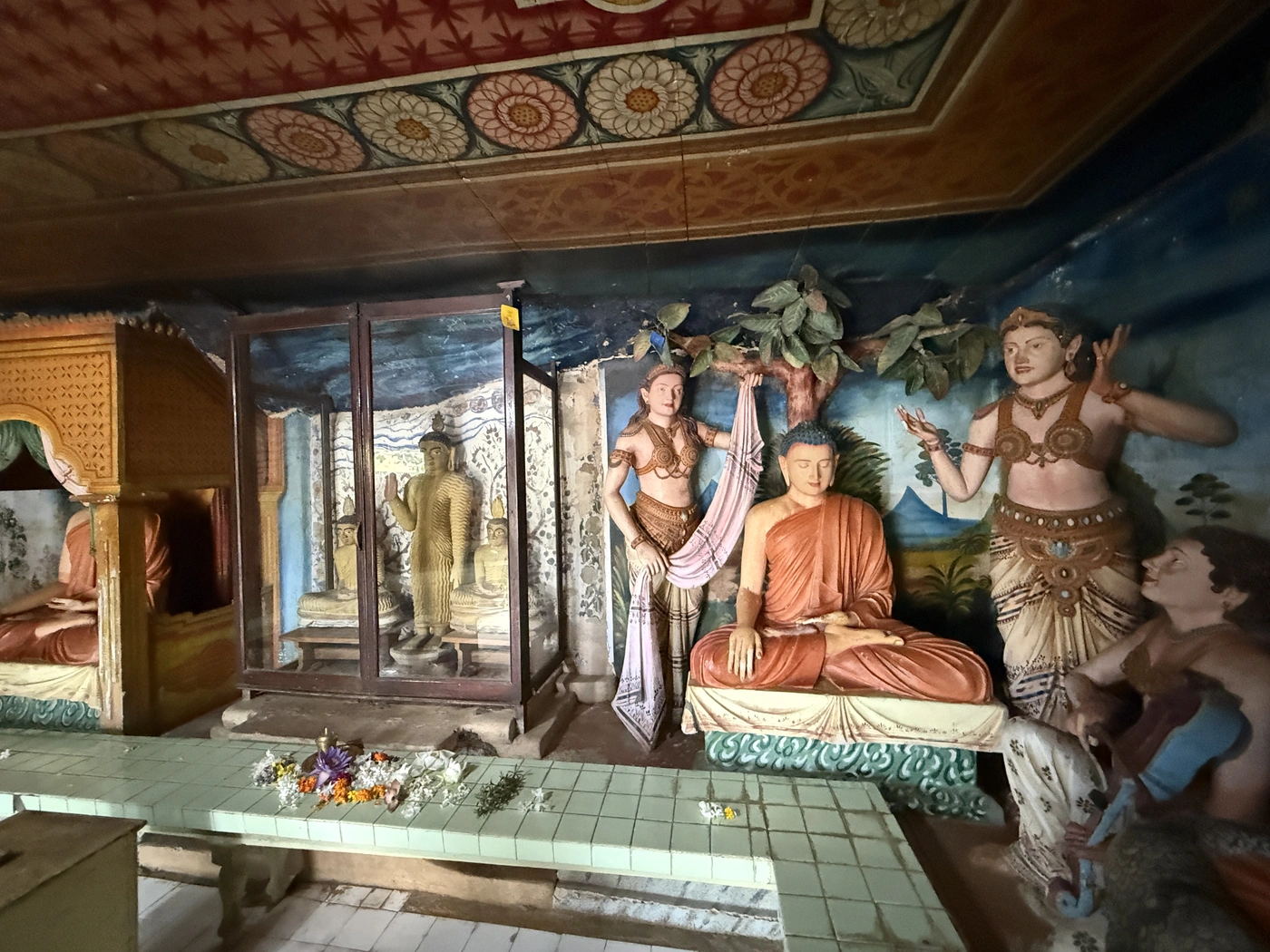 Seated Buddha statue with attendants