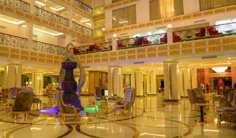 Multi-storey palace-style atrium with a large ornamental centrepiece at The Grand Kandyan