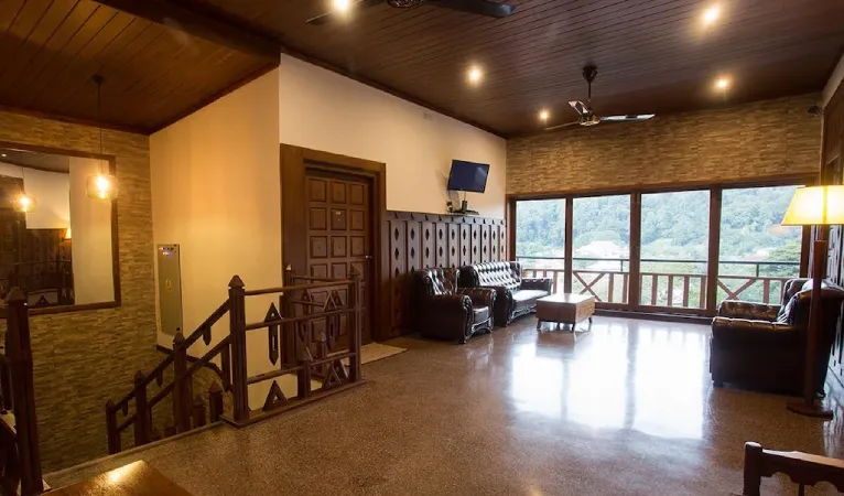 Lounge with timber ceiling, staircase and large windows at Heaven Seven Hotel
