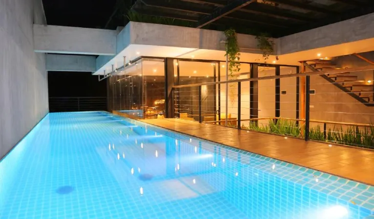 Swimming pool lit at night at Lakewood Residence Kandy