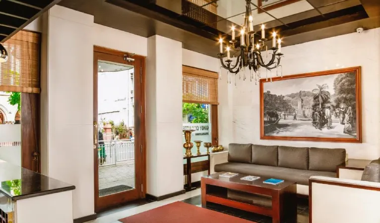 Lounge with chandelier and sofas at Kandy City Hotel by Earl's