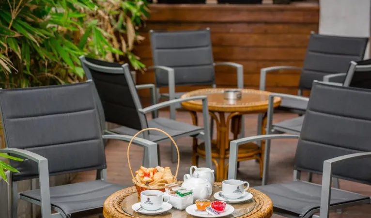 Tea and snacks on an outdoor table at Kandy City Hotel by Earl's