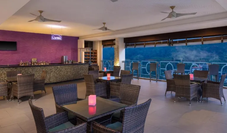 Bommu Rooftop Bar at Radisson Hotel Kandy with wicker chairs and an open-air terrace