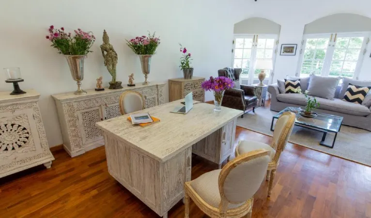 Suite with writing desk, fresh flowers and sofa at Ru Boutique Kandy