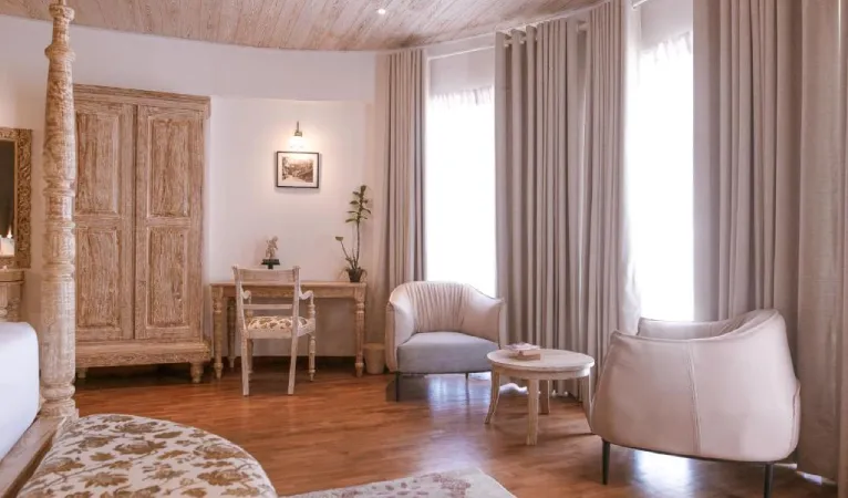 Room with carved wooden wardrobe and armchairs at Ru Boutique Kandy