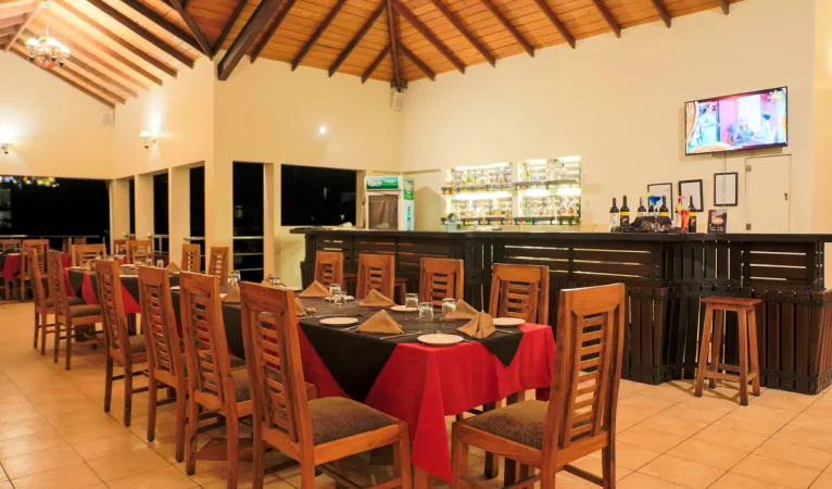 Restaurant and bar with red tablecloths at Oak Ray Senani Hotel Kandy