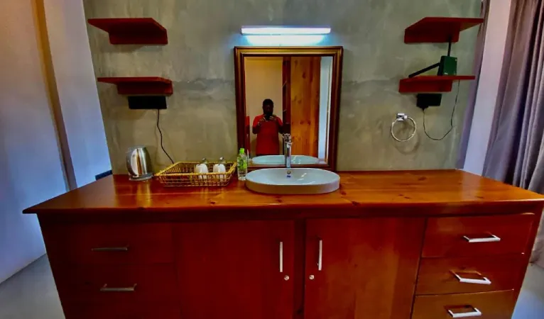Bathroom with wooden vanity at Sesatha Lake Kandy
