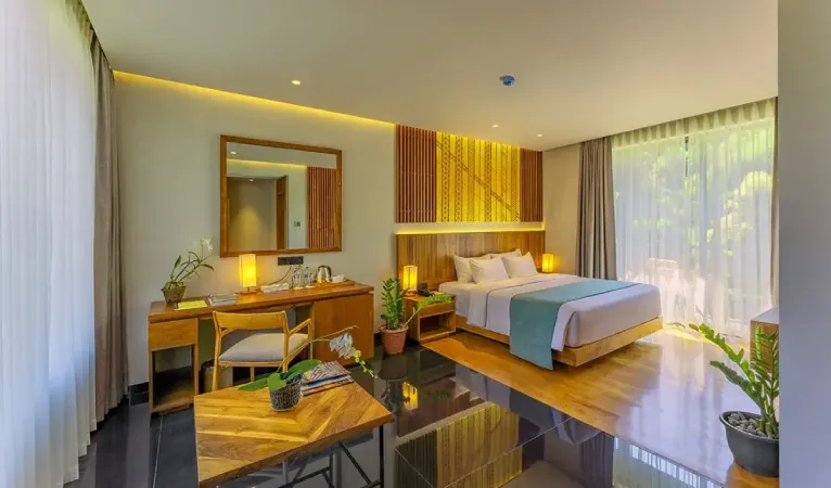 Guest room with wooden desk and large windows at The Trees Kandy