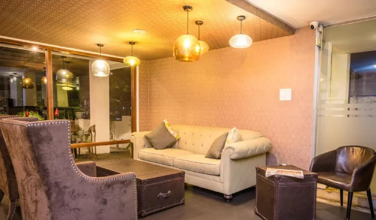 Lounge with cream sofa and pendant lights at Viyana Boutique Hotel Kandy